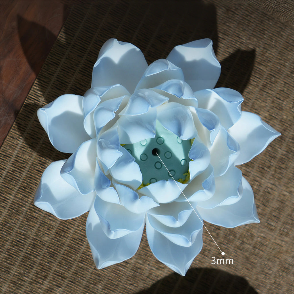 Azure blue lotus incense holder displayed on a wood table