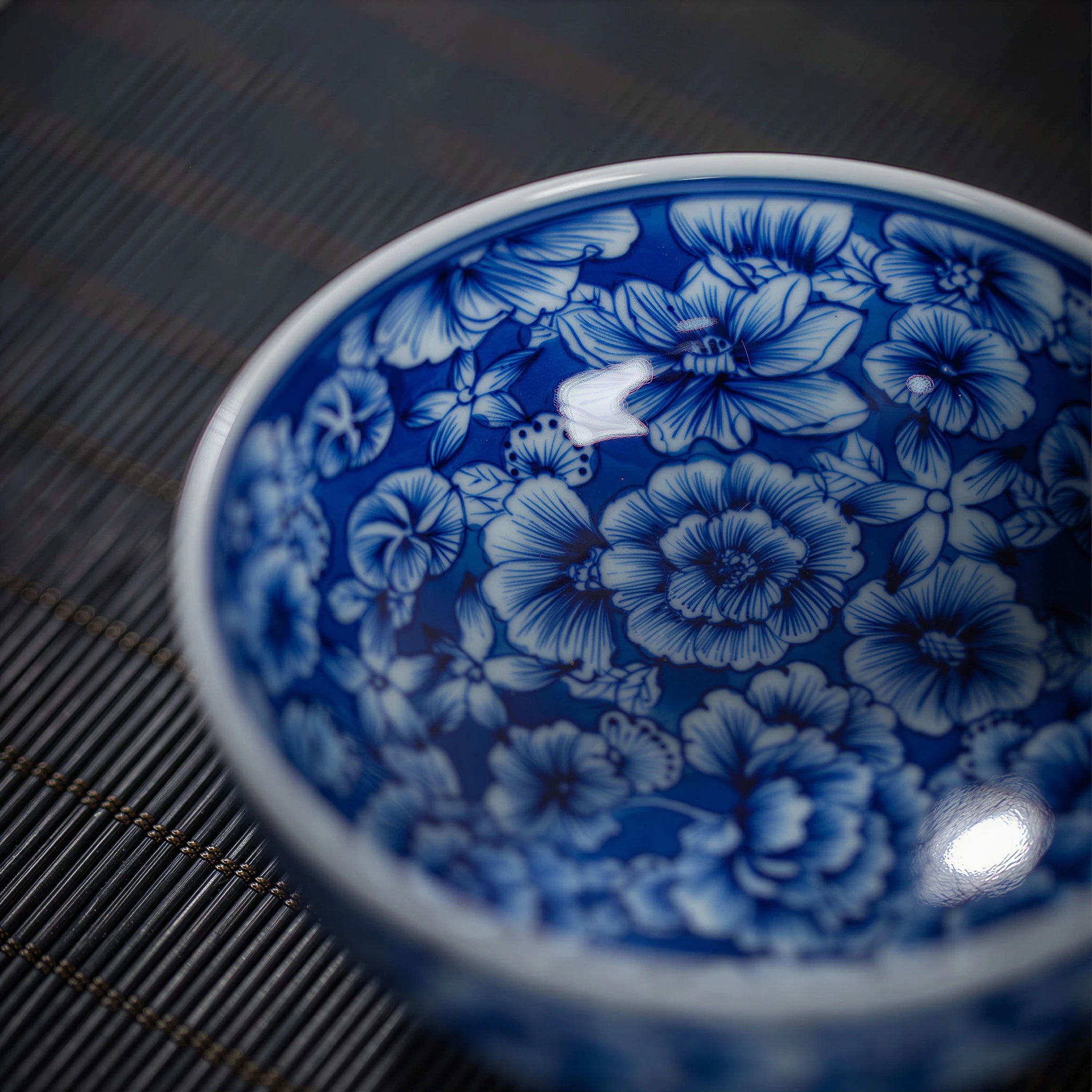 Close view of the dense cobalt floral brushwork