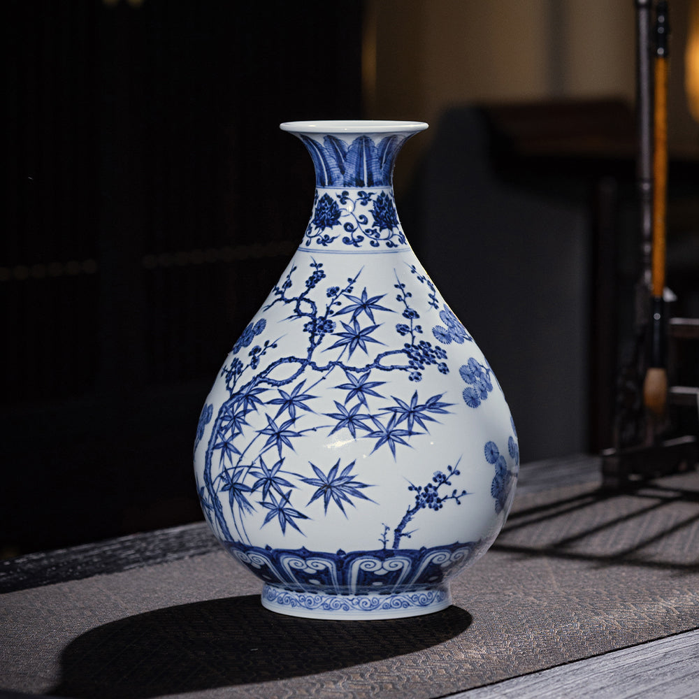 Side view of a blue-and-white Yuhuchun vase with bamboo leaves and plum branches
