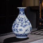 Side view of a blue-and-white Yuhuchun vase with bamboo leaves and plum branches