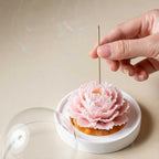 Blush pink porcelain carnation diffuser on a dressing table