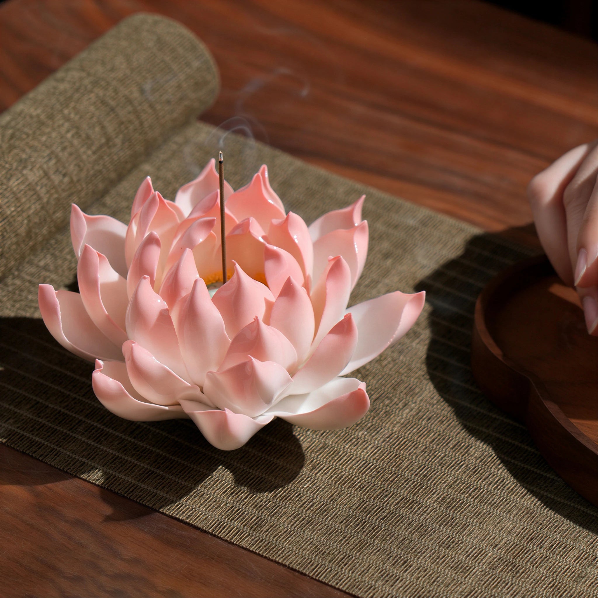 Front view of the blush pink porcelain lotus incense holder