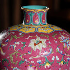 Gold-toned rim and neck detail on the carmine meiping