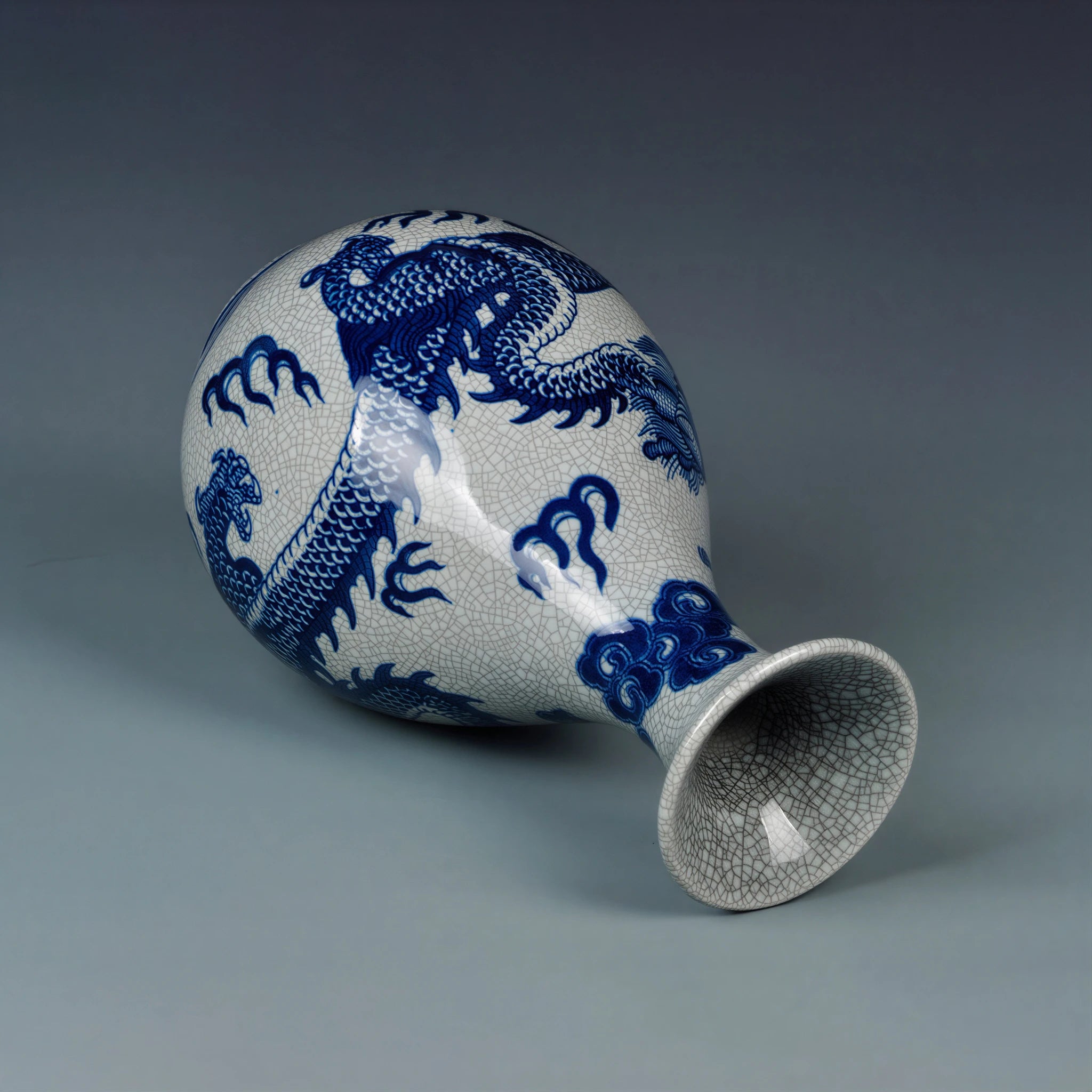 Close view of the cobalt-blue dragon, cloud forms and waves over crackle glaze