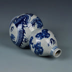 Side view of the double-gourd vase showing the dragon, cloud forms and fine crackle glaze