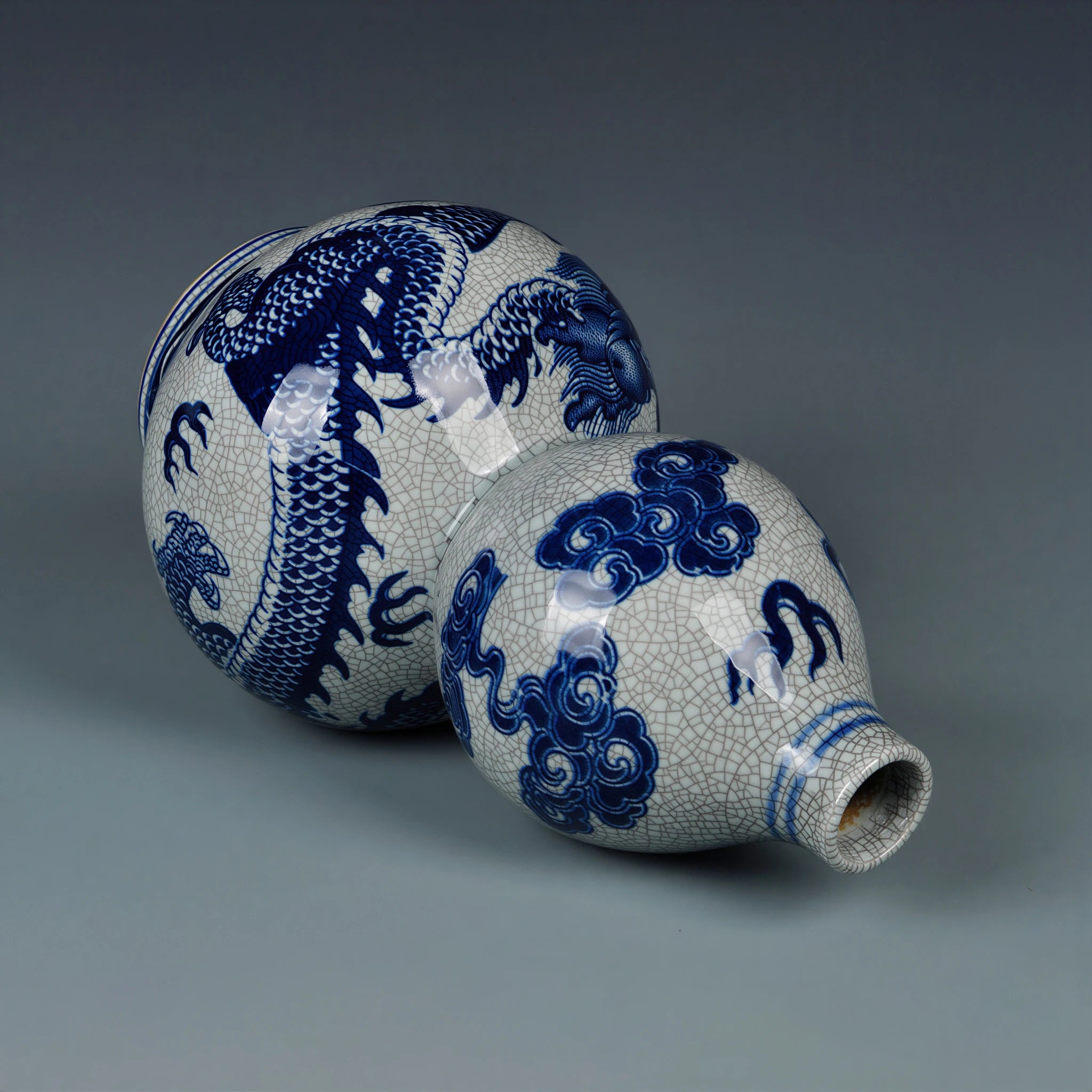 Side view of the double-gourd vase showing the dragon, cloud forms and fine crackle glaze