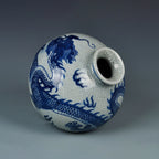 Close view of the cobalt-blue dragon wrapping around the globular crackle-glazed body