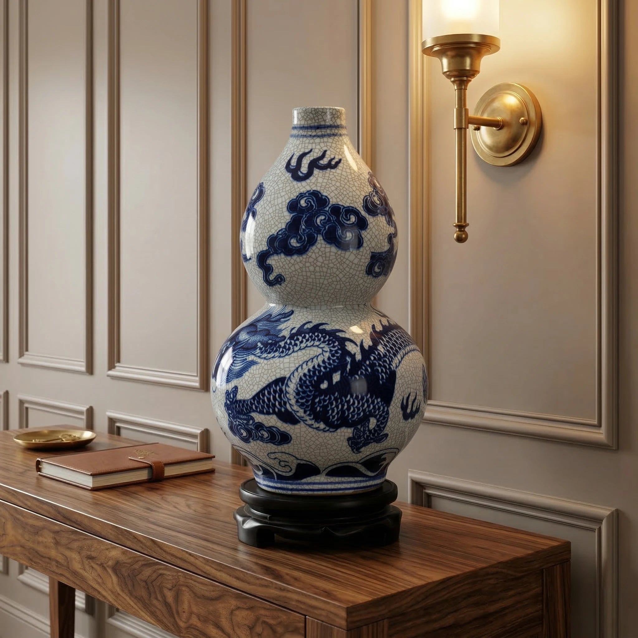 Cobalt dragon double-gourd vase displayed on its wooden stand on a walnut entryway console