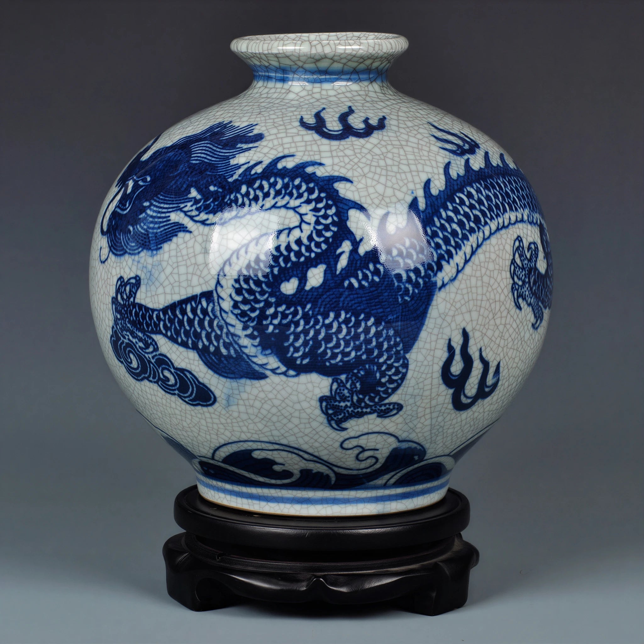Full view of the wide-mouth cobalt dragon vase on its fitted wooden stand