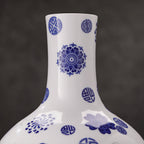 Close view of cobalt floral medallions and leaves on the rounded porcelain body