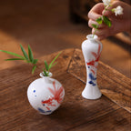 Compact round and slim goldfish porcelain vases styled with small stem