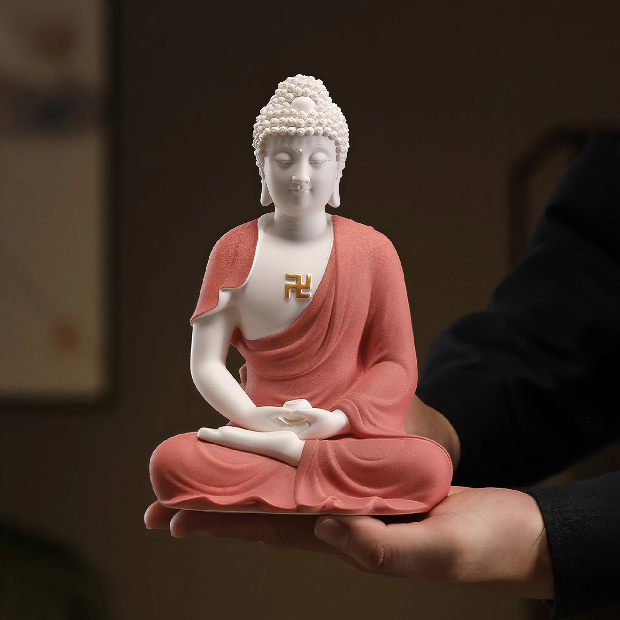 Hand-held view showing the scale of the coral red Amitabha Buddha sculpture