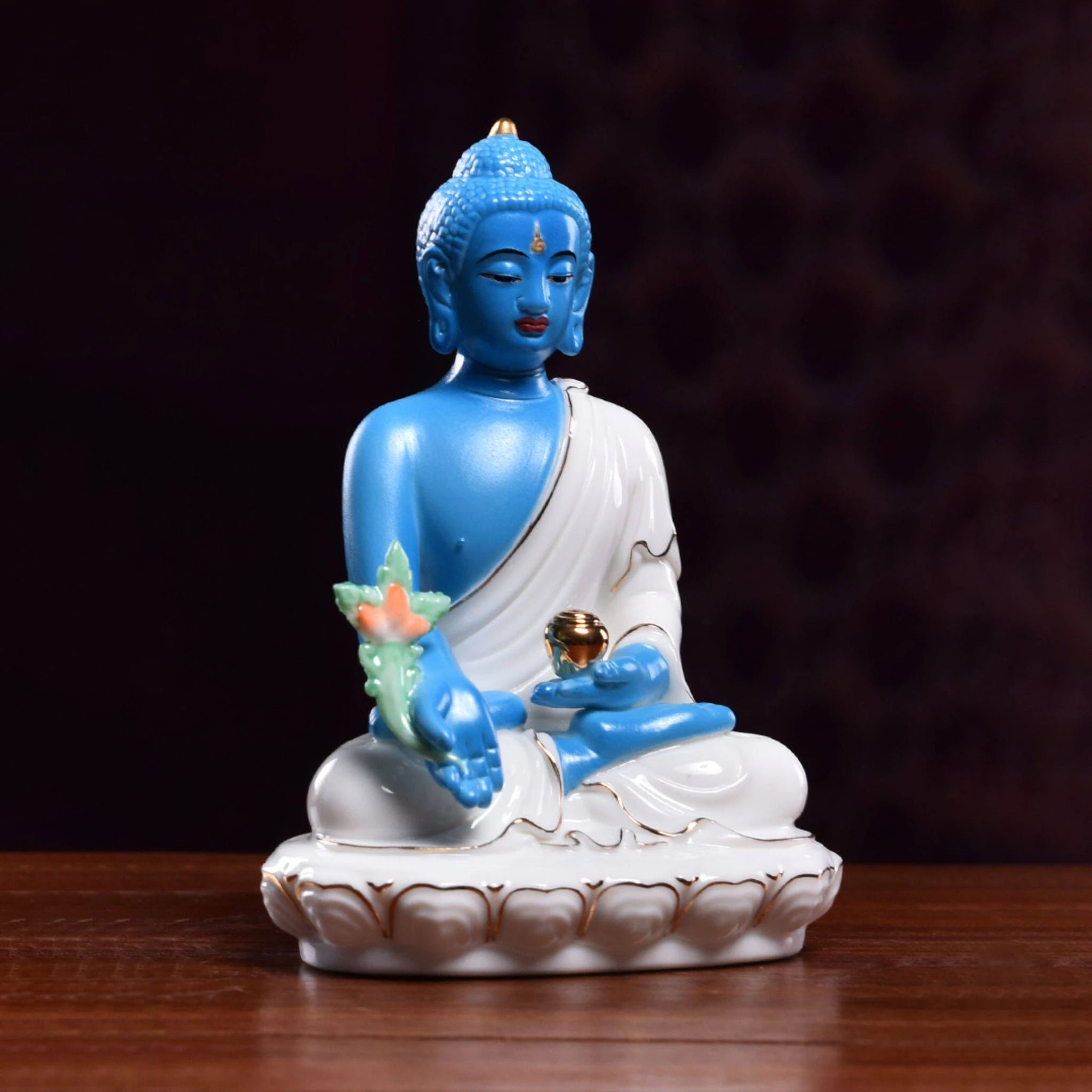Three-quarter view of blue Medicine Buddha against white porcelain robes