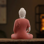 Back view of the coral Amitabha sculpture with an impressed workshop-style mark