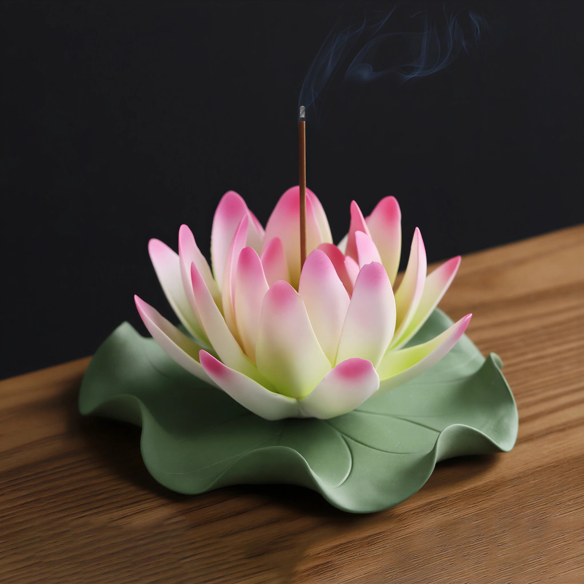Crimson red porcelain lotus on its green lily pad base