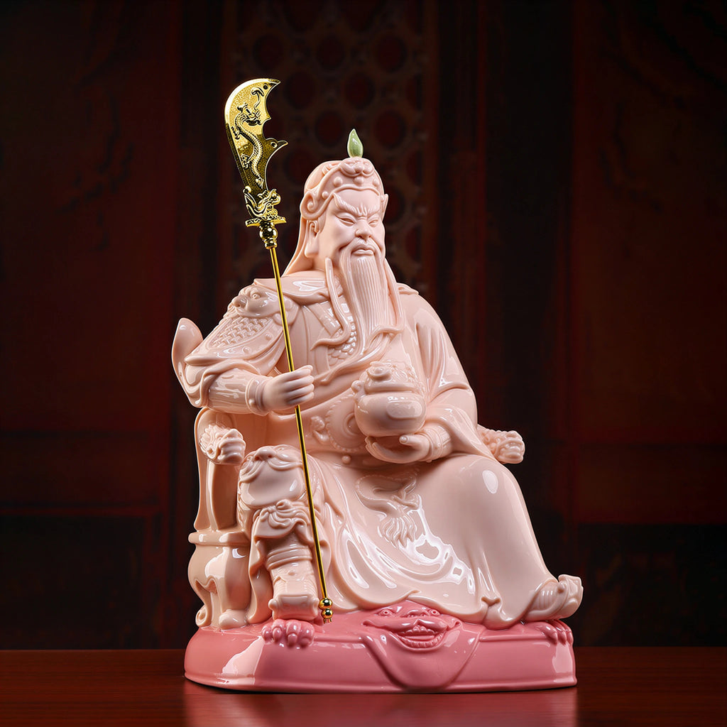 Angled view of the crimson seated Guan Gong and guardian-lion base