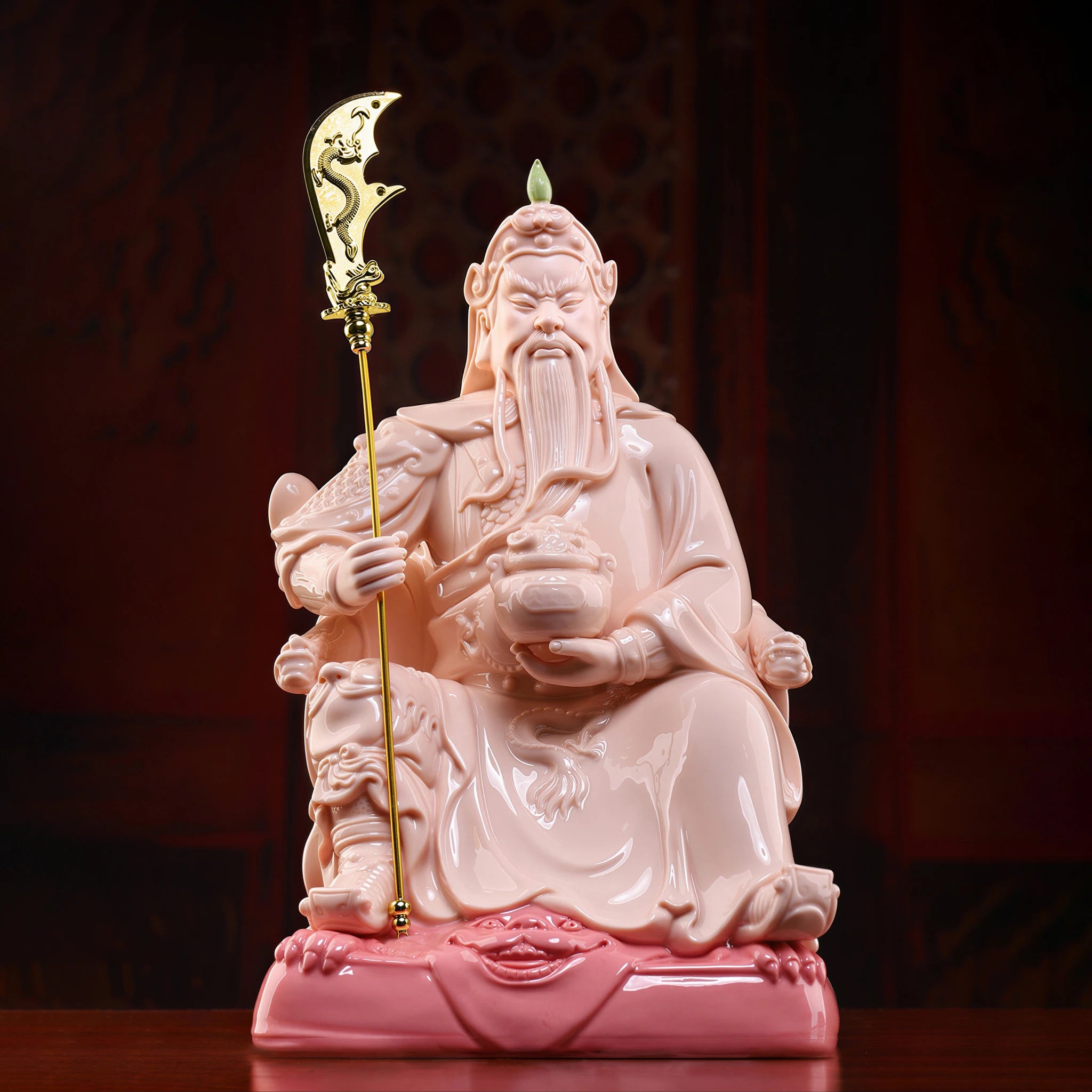 Front view of the crimson-glazed seated Guan Gong porcelain sculpture