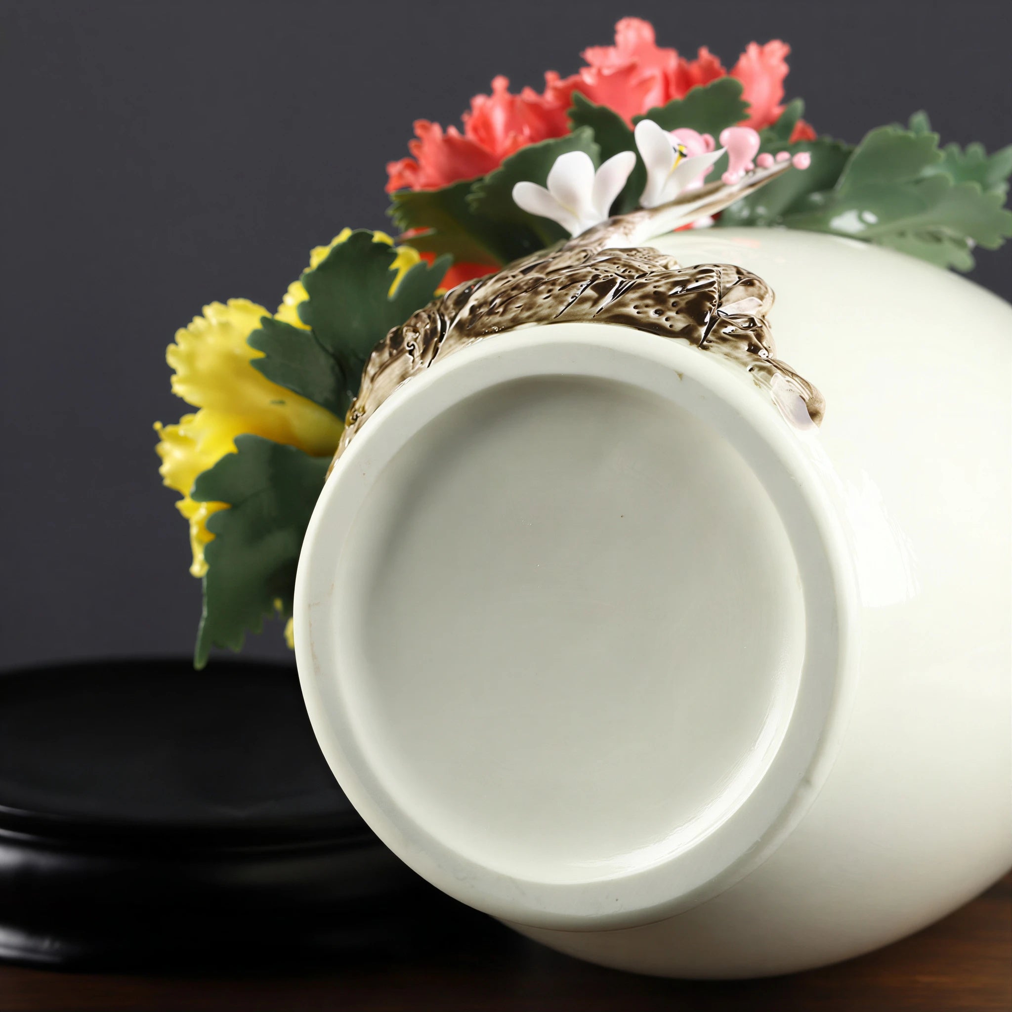 Underside and lower applied branch of the Dehua floral relief vase