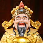 Close view of the genial Fu Bao Caishen expression and crown