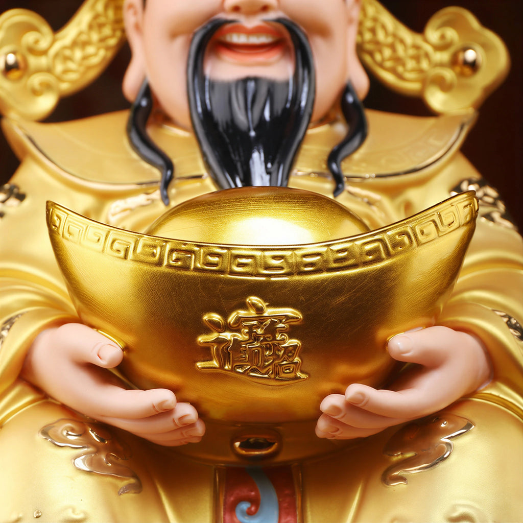 Close view of the hands holding a gold-colored ingot