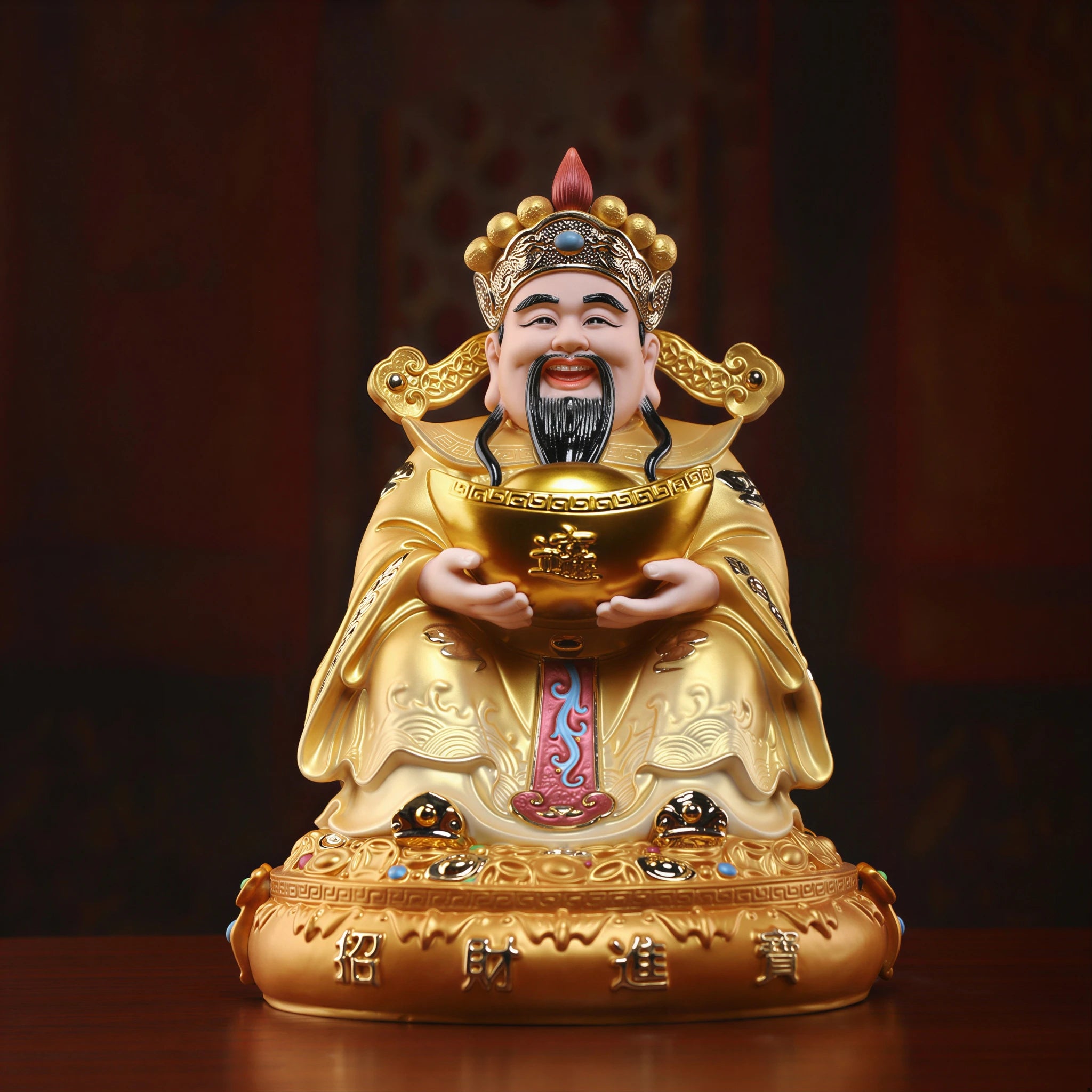 Front view of the pearl-gold Fu Bao Caishen holding an ingot