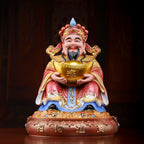 Front view of the pearl-red Fu Bao Caishen porcelain sculpture