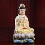 Angled view of the gold-toned robe and white porcelain reverse