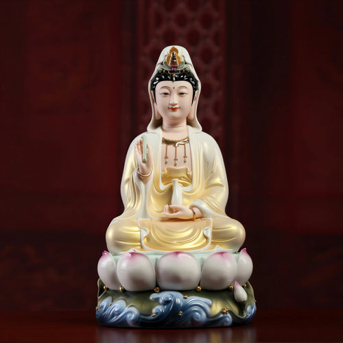 Front view of the Dehua Guanyin with a gold-toned robe