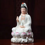 Angled view of the gold-toned contour lines on the Guanyin sculpture