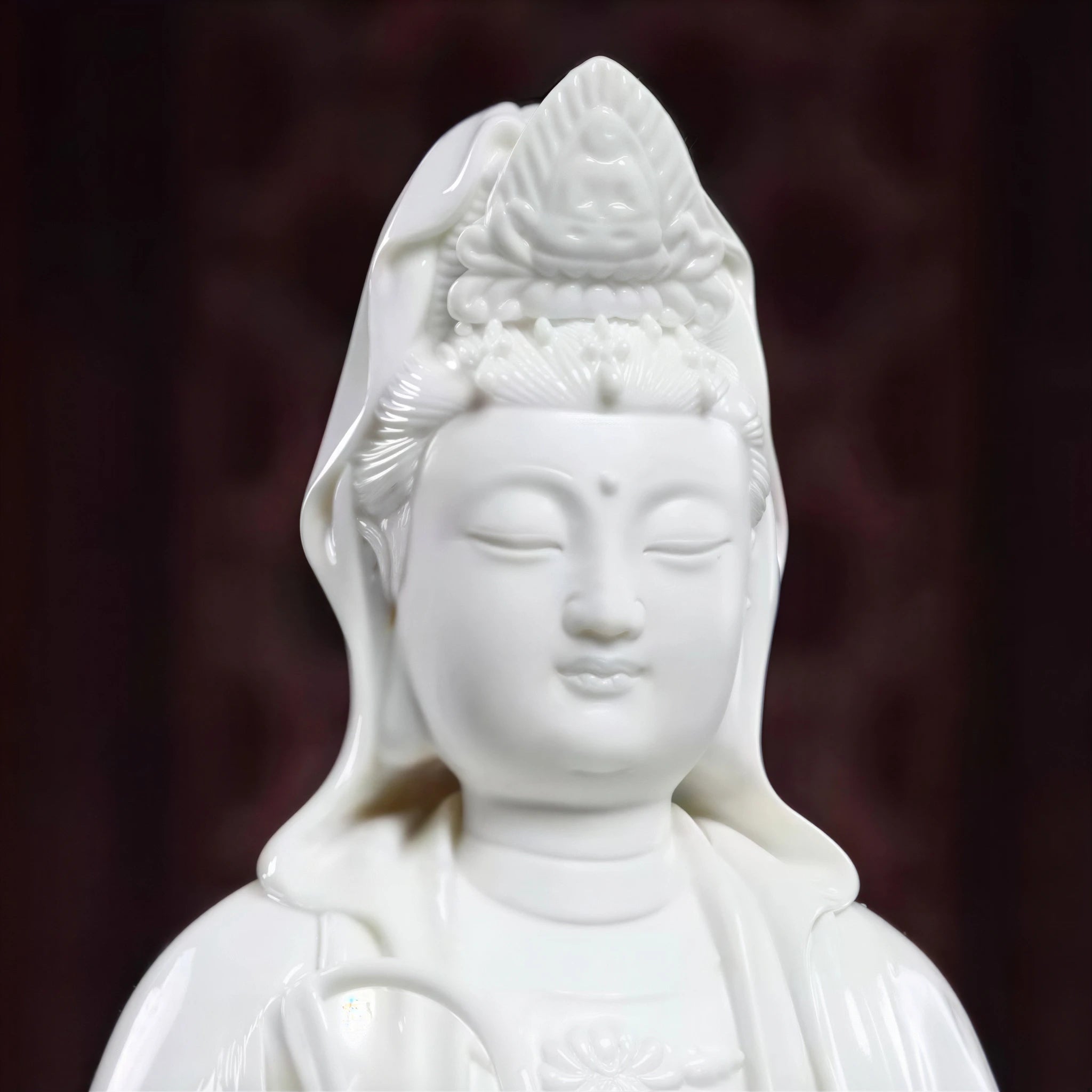 Close view of the Guanyin face and white porcelain headdress
