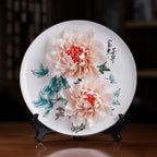Front view of a Dehua porcelain display plate with hand-modeled peonies