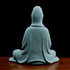 Rear view of the hooded robes on the white Dehua Guanyin sculpture