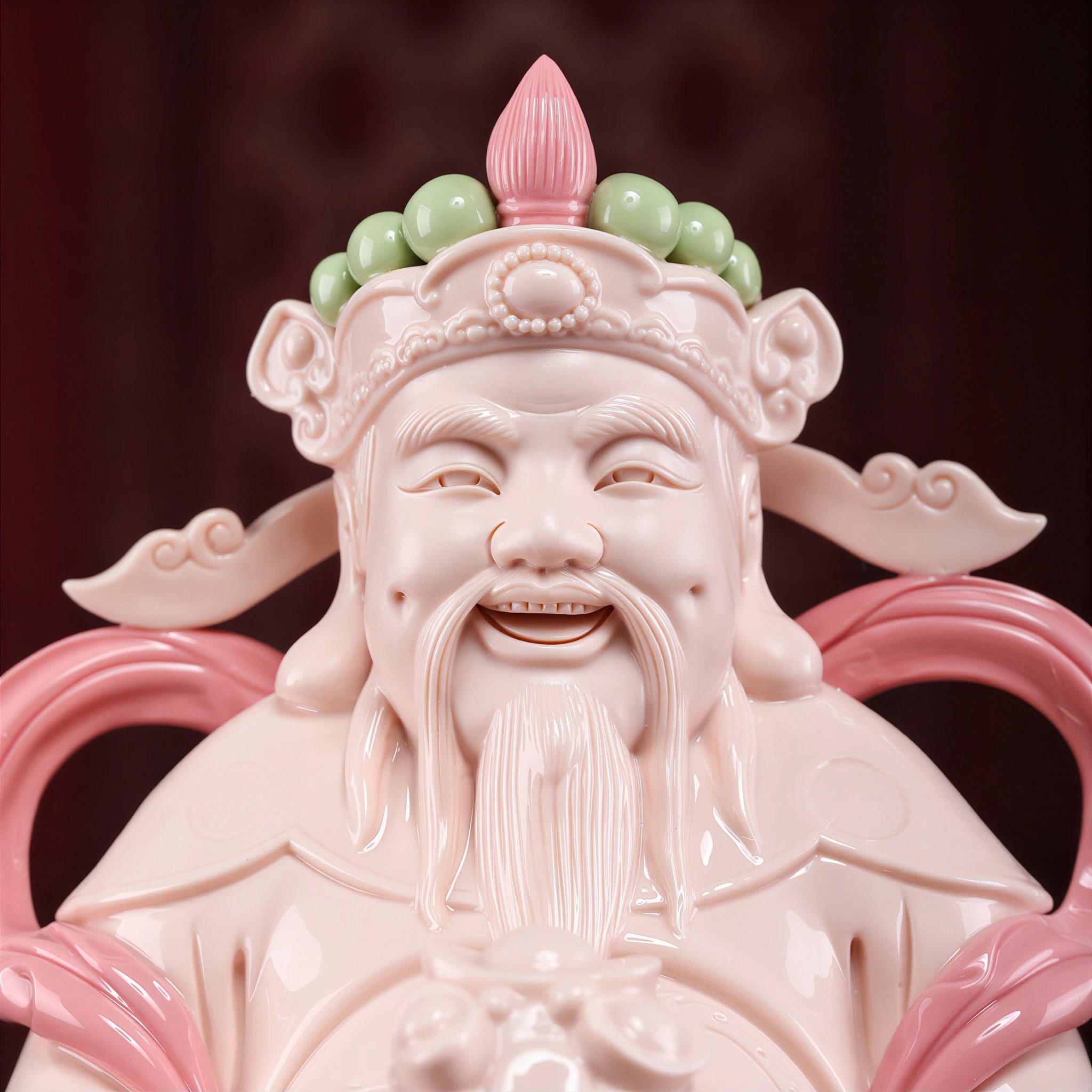 Close view of the Civil Caishen face, crown and jade-red glaze