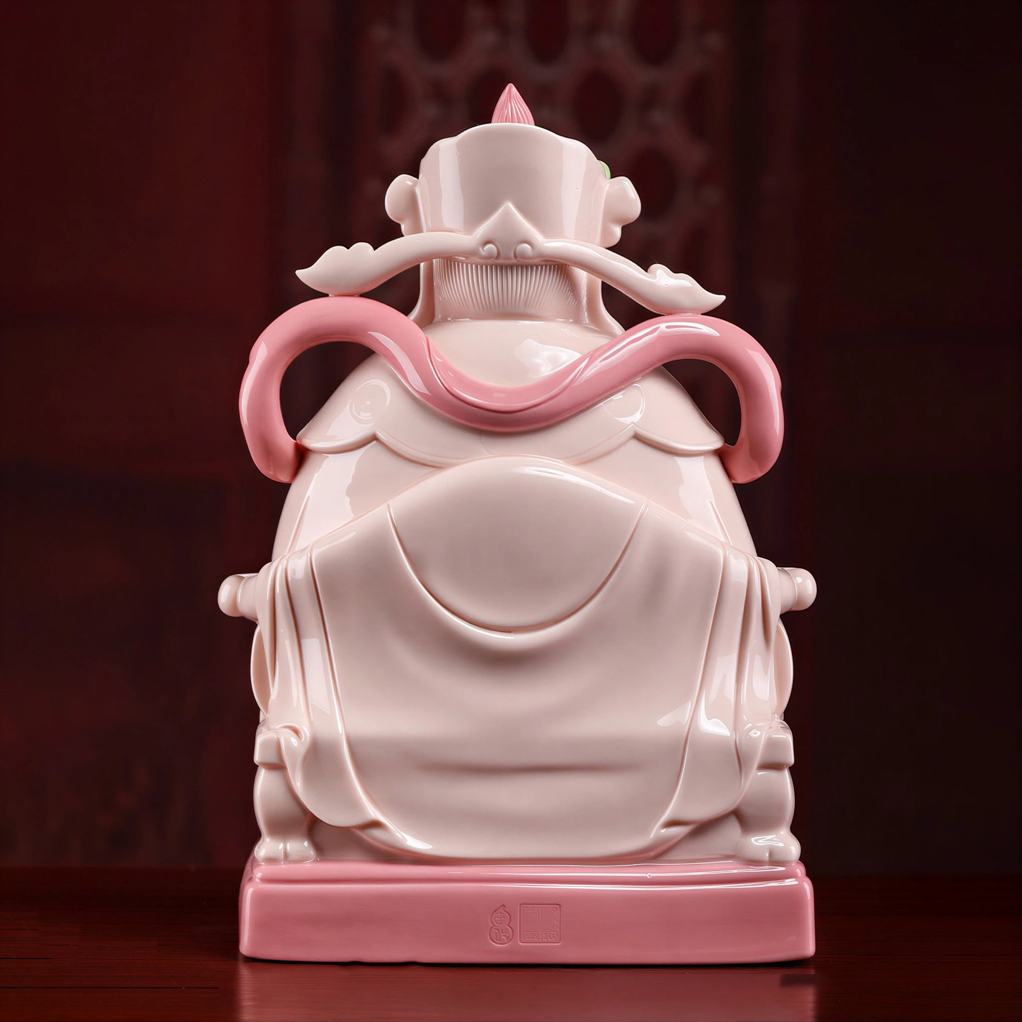 Rear view of the jade-red Dehua Caishen and flowing robe