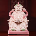 Front view of a jade-red Dehua Civil Caishen holding a treasure bowl