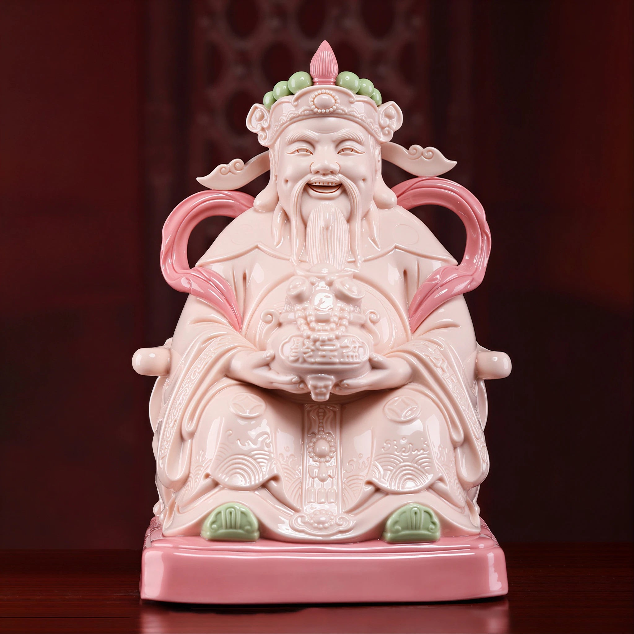 Front view of a jade-red Dehua Civil Caishen holding a treasure bowl