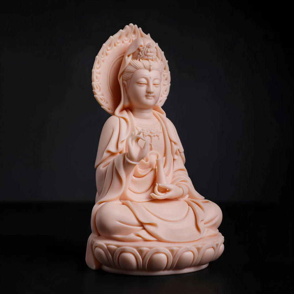Angled view of the jade-red Guanyin sculpture and layered flame-shaped mandorla