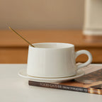 Side profile of the Dehua white porcelain coffee cup with rounded loop handle