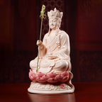 Close view of the Ksitigarbha face above the red-glazed base