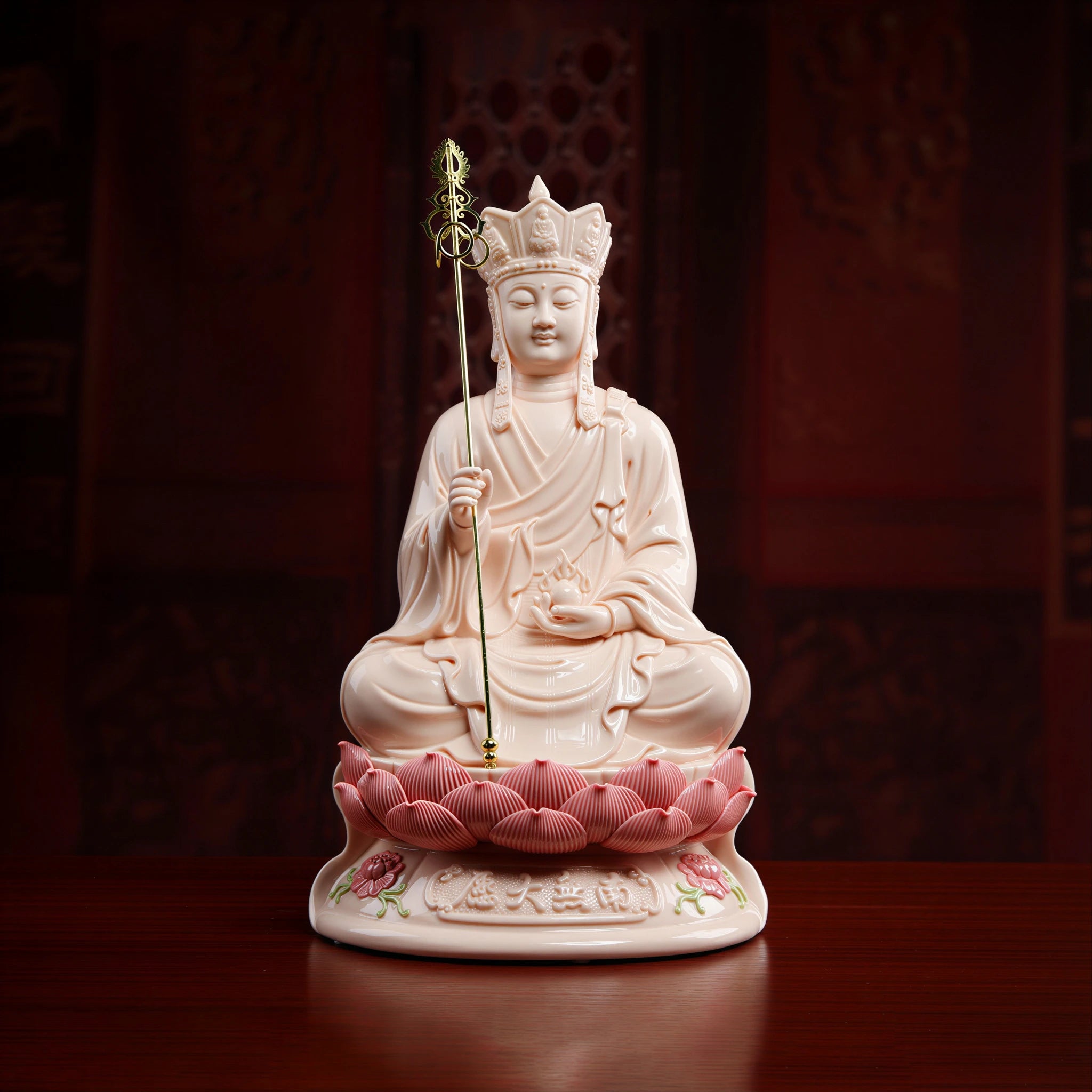 Front view of Dehua porcelain Ksitigarbha with a red-glazed lotus base