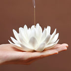 Lotus and lily pad incense holder held in one hand