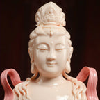 Close view of the Manjushri face, crown and jewelry details