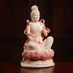 Profile view of Manjushri with flowing celestial ribbons and lotus base