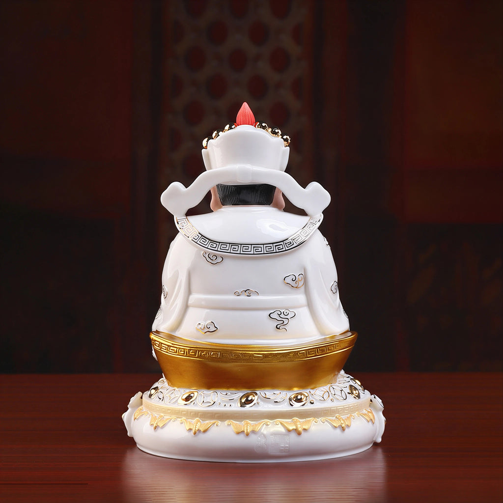 Back view of the white glazed robes and gold-toned details