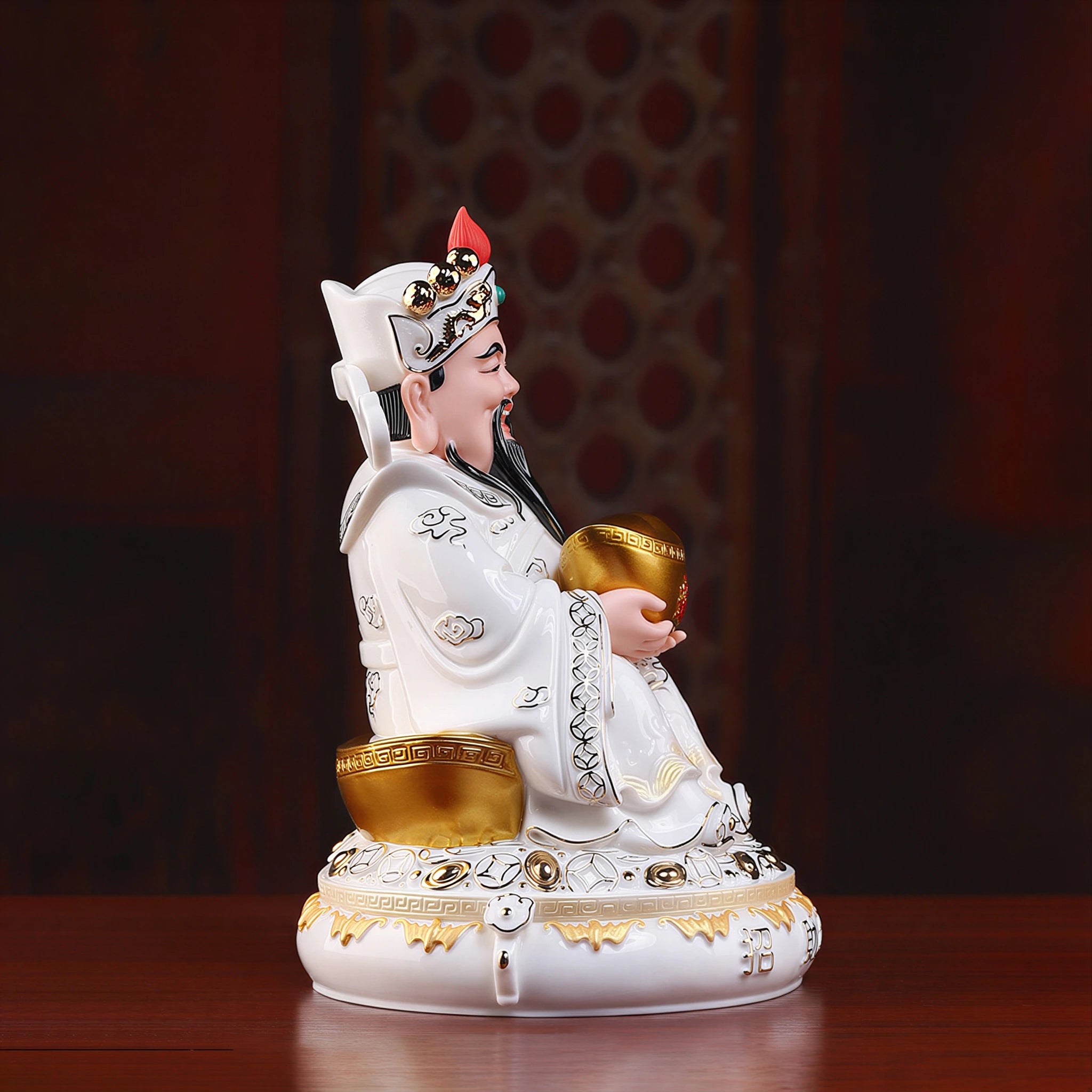 Side profile of a painted Dehua porcelain Caishen figure