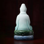 Rear view of the flowing pale blue porcelain robe