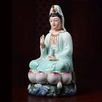 Three-quarter view of the pale blue Dehua Guanyin sculpture