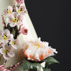 Pale peony and plum blossom relief rising along the Yuhuchun vase