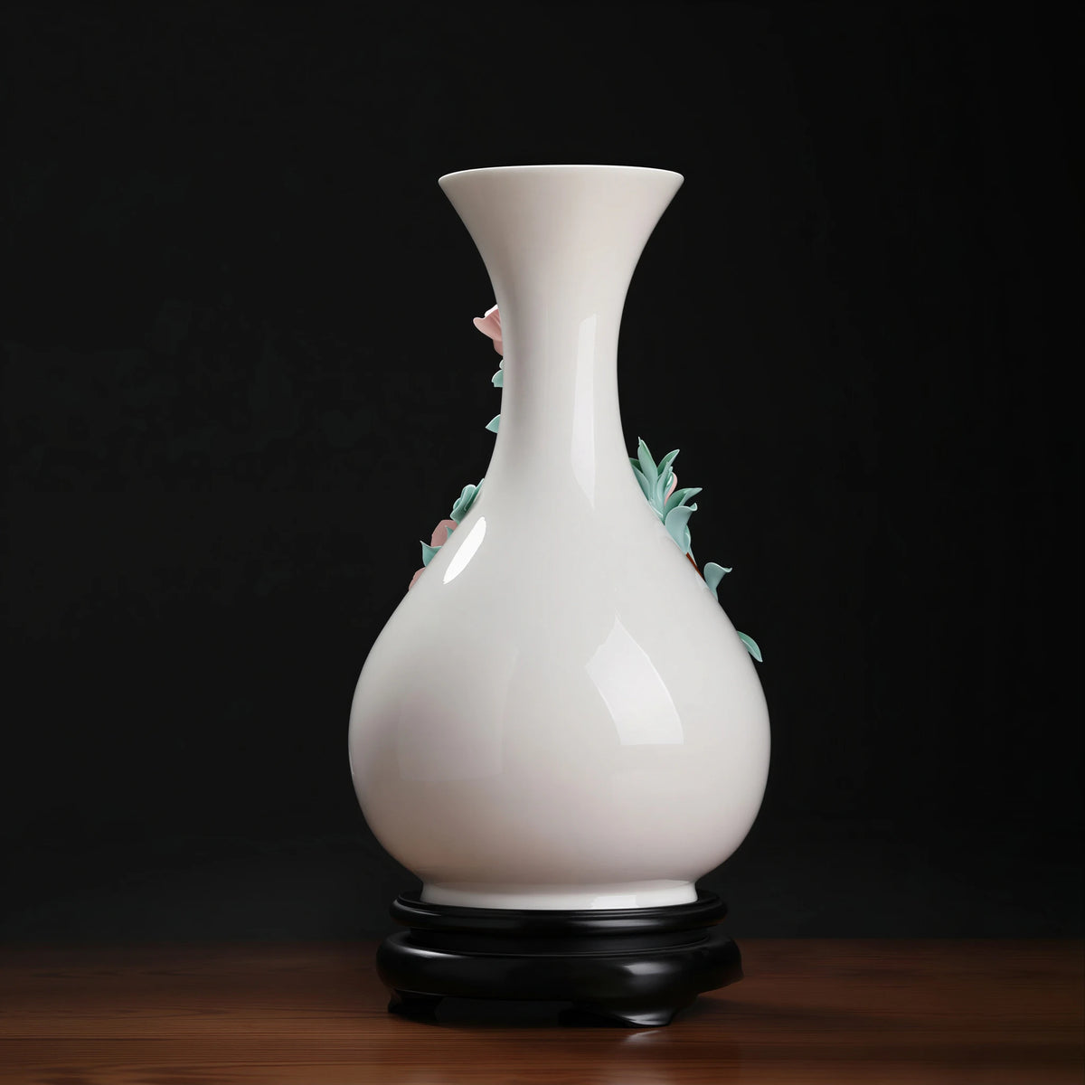 Rear profile of the white pear-shaped vase with the relief visible at the sides
