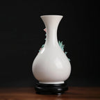 Rear profile of the pear-shaped white porcelain vase and black stand